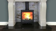 Atlntic Pearl 8kW black stove in an alcove.