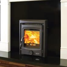 Atlantic Bay inset stove in a fireplace.