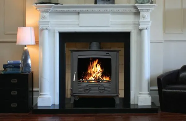 Henley Druid 30kw boiler stove in a fireplace.