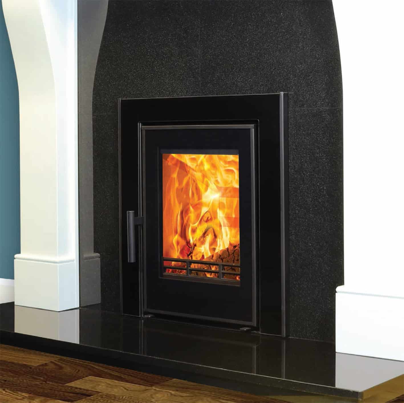 Atlantic Wave 5kW inset stove in a fireplace.