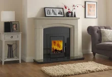 Vitae 6 kw inset stove in fireplace.